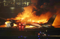 A Japan Airlines plane collides with a Japan Coast Guard aircraft on a runway and bursts into flames at Tokyo's Haneda Airport at 7 p.m. Jan. 2.