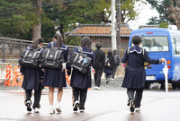 Junior high school students leave school and go on winter break in the city of Wajima, Ishikawa Prefecture, on Dec. 24.