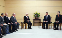 Prime Minister Shigeru Ishiba (second from right) meets with Terumi Tanaka (fourth from left), co-chair of the Japan Confederation of A- and H-Bomb Sufferers Organizations (Nihon Hidankyo), which won the 2024 Nobel Peace Prize, and other members of the group at the prime minister's office on Wednesday.