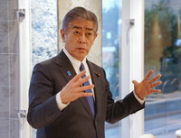 Foreign Minister Takeshi Iwaya speaks to reporters in Beppu, Oita Prefecture, on Saturday.