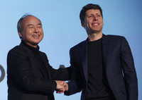 SoftBank Group Chairman and CEO Masayoshi Son (left) and OpenAI CEO Sam Altman shake hands in Tokyo on Monday.