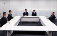 Officials from Japan's ruling Liberal Democratic Party, its Komeito ally and opposition Nippon Ishin no Kai (Japan Innovation Party) hold a meeting on Monday.