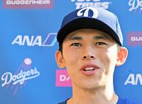 The Dodgers' Japanese pitcher Roki Sasaki speaks with reporters in Glendale, Arizona, Friday after announcing his marriage on Instagram earlier in the day.