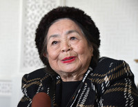 Setsuko Thurlow, a hibakusha atomic bomb survivor, speaks with Japanese reporters at the U.N. headquarters in New York on Monday.