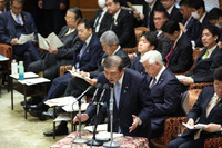 Prime Minister Shigeru Ishiba (center) speaks at a meeting of the House of Representatives Budget Committee on Tuesday.