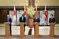 Japanese economy minister Yoji Muto (far right), Foreign Minister Takeshi Iwaya (second from right), British Foreign Secretary David Lammy (second from left) and Business and Trade Secretary Jonathan Reynolds (far left) hold a joint press conference after their meeting in Tokyo on Friday. (Pool photo)