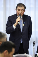 Prime Minister Shigeru Ishiba speaks at a meeting in Tokyo of secretaries-general of the Liberal Democratic Party's local branches on Saturday.