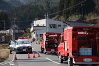 Fire trucks head toward the site of a wildfire in Ofunato, Iwate Prefecture, northeastern Japan, on Monday.