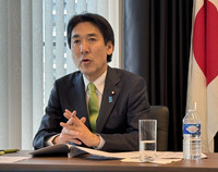 Japanese economic security minister Minoru Kiuchi speaks at a press conference in Brussels on Wednesday.