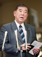 Japanese Prime Minister Shigeru Ishiba speaks with reporters on Japan-U.S. tariff negotiations at his official residence in Tokyo on Saturday.