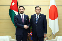 Japanese Prime Minister Shigeru Ishiba (right) shakes hands with Jordan's Crown Prince Al Hussein bin Abdullah II at the prime minister's office in Tokyo on Thursday.
