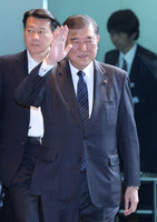 Prime Minister Shigeru Ishiba enters his office in Tokyo on Friday.