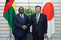 Japanese Prime Minister Shigeru Ishiba (right) shakes hands with Guinea-Bissau President Umaro Sissoco Embalo before their meeting at the prime minister's office in Tokyo on Monday.
