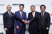 From left to right, PayPay President Ichiro Nakayama, SoftBank President Junichi Miyakawa, Sumitomo Mitsui Financial Group President Toru Nakashima and Sumitomo Mitsui Card President Yukihiko Onishi pose for a photo at a press conference in Tokyo's Chiyoda Ward on Thursday.