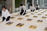 Nagasaki city staff airing out the register of atomic bomb victims Friday