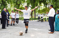 Nozomu Hagihara dribbles across the finish line at the Japanese Embassy in New Delhi on Thursday after a 2,000-kilometer dribbling journey in India.