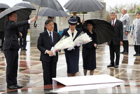 Japan's Emperor Naruhito and Empress Masako offer flowers for the war dead at a park in Ioto, a Pacific island widely known as Iwo Jima, on April 7. (Pool photo)