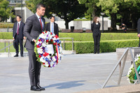 Paraguayan President Santiago Pena (foreground) lays flowers at the cenotaph for the victims of the 1945 atomic bombing of the western Japan city of Hiroshima on Tuesday.
