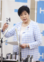 Tokyo Governor Yuriko Koike answers questions from reporters Tuesday.