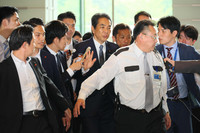 Agriculture Minister Taku Eto (center) enters the prime minister's office in Tokyo on Wednesday morning.