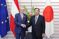 Prime Minister Shigeru Ishiba (right) and Austrian President Alexander Van der Bellen shake hands before their talks at the prime minister's office in Tokyo on Wednesday.