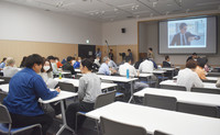 Probation officers and others attend a lecture held as part of the Shiga Kaname Project in Kusatsu, Shiga Prefecture, on Tuesday.