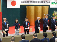 Narita International Airport President Akihiko Tamura (far left), and others attend a ceremony to mark the start of full-scale construction work to enhance the airport's functions in the city of Narita, Chiba Prefecture, on Sunday.