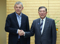 Japanese Prime Minister Shigeru Ishiba (right) meets with Philippe Lazzarini, commissioner-general of the U.N. Relief and Works Agency for Palestine Refugees in the Near East, or UNRWA, at the prime minister's office in Tokyo on Tuesday.