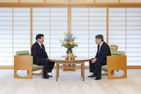 Japan's Emperor Naruhito (right) meets with Lao President Thongloun Sisoulith at the Imperial Palace in Tokyo on Friday. (Courtesy of the Imperial Household Agency)