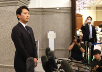 Hyogo Governor Motohiko Saito speaks to reporters after a prefectural assembly meeting on Tuesday.