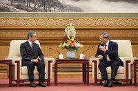 Former Japanese House of Representatives Speaker Yohei Kono (left) talks with Chinese Premier Li Qiang in Beijing on Tuesday. (Pool photo)
