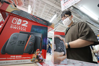 A customer buys the Nintendo Switch 2 game console in Tokyo on Thursday.