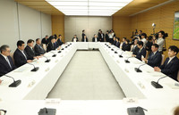 Japanese Prime Minister Shigeru Ishiba (fourth from left) convenes a ministerial meeting on foreigners' medical bill and insurance premium payment in Tokyo on Friday.