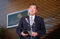 Japanese Prime Minister Shigeru Ishiba speaks to reporters at his office in Tokyo on Monday.