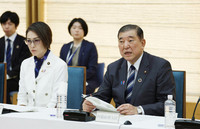 Prime Minister Shigeru Ishiba (right) speaks at a joint meeting of government task forces for female empowerment and gender equality at the prime minister's office Tuesday.