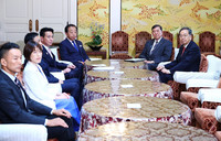Japanese Prime Minister Shigeru Ishiba (second from right) meets with leaders of opposition parties in Tokyo on Thursday.