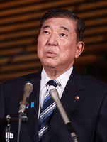 Japanese Prime Minister Shigeru Ishiba speaks to reporters at his office in Tokyo on Friday.