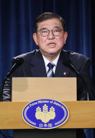 Japanese Prime Minister Shigeru Ishiba speaks at a press conference in Calgary, Canada, on Tuesday. (Pool photo)