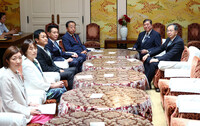 Japanese Prime Minister Shigeru Ishiba (second from right) meets with opposition leaders in Tokyo on Thursday.