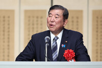 Japanese Prime Minister Shigeru Ishiba delivers a speech at a reception in Tokyo on Thursday to mark the 60th anniversary this year of the normalization of Japan-South Korea diplomatic relations.