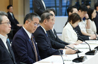 Prime Minister Shigeru Ishiba (center) speaks at a reconstruction promotion meeting at the prime minister's office in Tokyo on Friday.