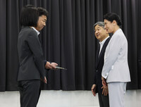 Emperor Naruhito (second right) and Empress Masako (far right) meet with survivors of the August 2014 sediment disaster at the Hiroshima City Torrential Rain Disaster Memorial Center in the city's Asaminami Ward on Friday. (Pool photo)