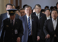 Japanese Prime Minister Shigeru Ishiba (center) makes courtesy visits to each political party in Tokyo on Friday.