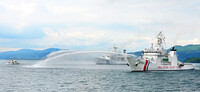 Patrol boats spray water in a joint drill conducted by the Japanese, U.S. and Philippine coast guards in Kagoshima Bay on Friday.