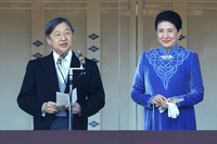 Emperor Naruhito and Empress Masako greet people gathered at the Imperial Palace in Tokyo to celebrate the Emperor's 65th birthday on Feb. 23.