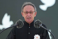 Okinawa Governor Denny Tamaki reads a peace declaration in a memorial ceremony for the war dead in Okinawa Prefecture, at the Peace Memorial Park in the city of Itoman, Okinawa, on Monday.