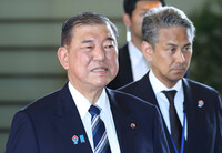 Prime Minister Shigeru Ishiba (left), head of the Liberal Democratic Party, entering the prime minister's office in Tokyo on Tuesday morning
