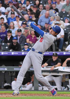 Shohei Ohtani of the Los Angeles Dodgers hits a two-run home run during the sixth inning in the team's away game against the Colorado Rockies on Tuesday, marking his 300th homer in his combined professional career in Japan and the United States.
