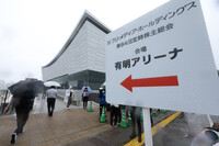 People heading to the venue of Fuji Media Holdings' shareholders meeting in Tokyo on Wednesday