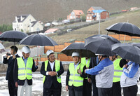 Japan's Emperor Naruhito receives an explanation on the rooftop of a water storage facility at the Gachuurt water source in Ulaanbaatar on Monday.